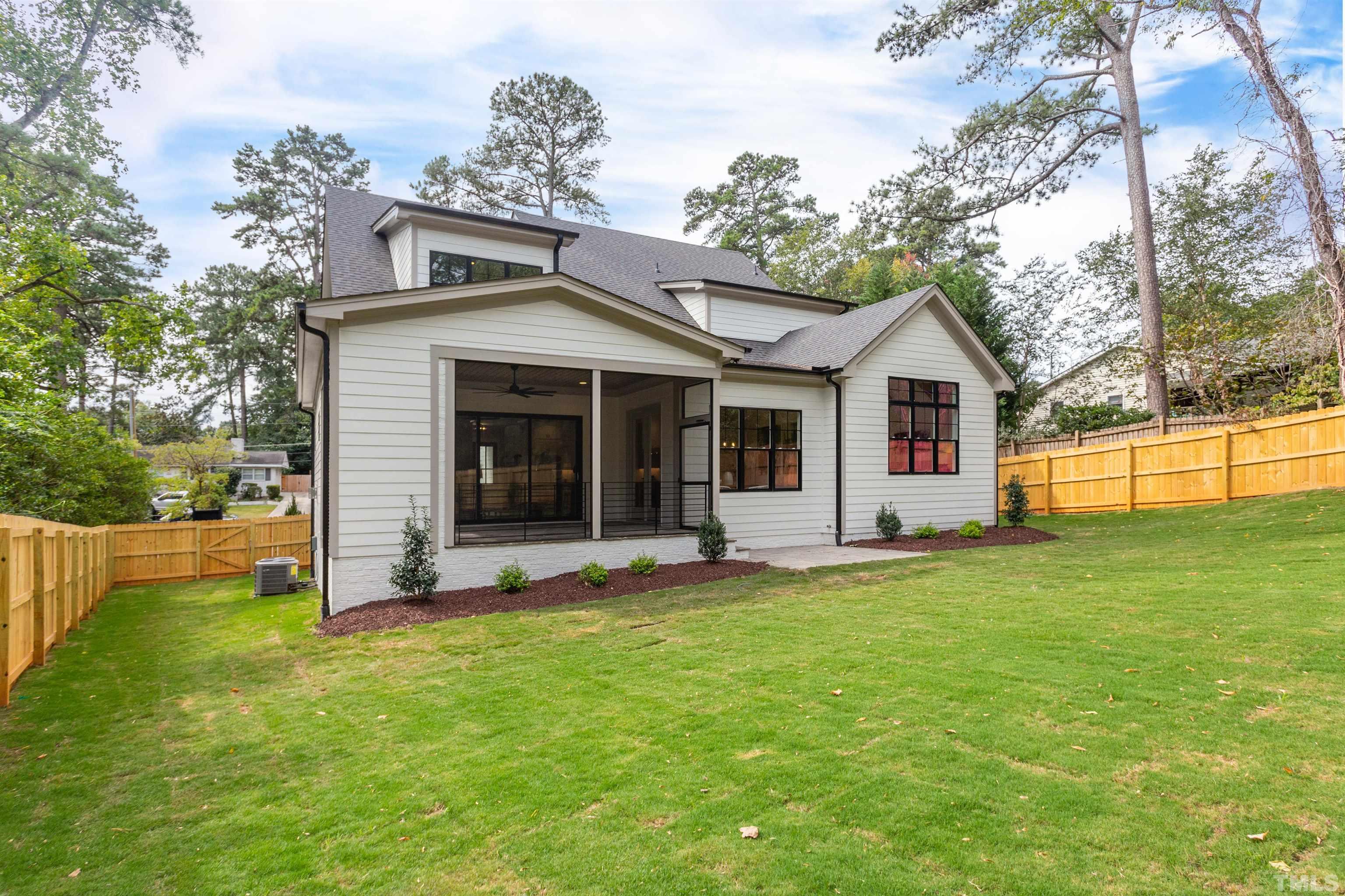 3508 Leonard Street Raleigh, NC 27607 - Photo 46 of 54 a front view of a house with a yard and garage