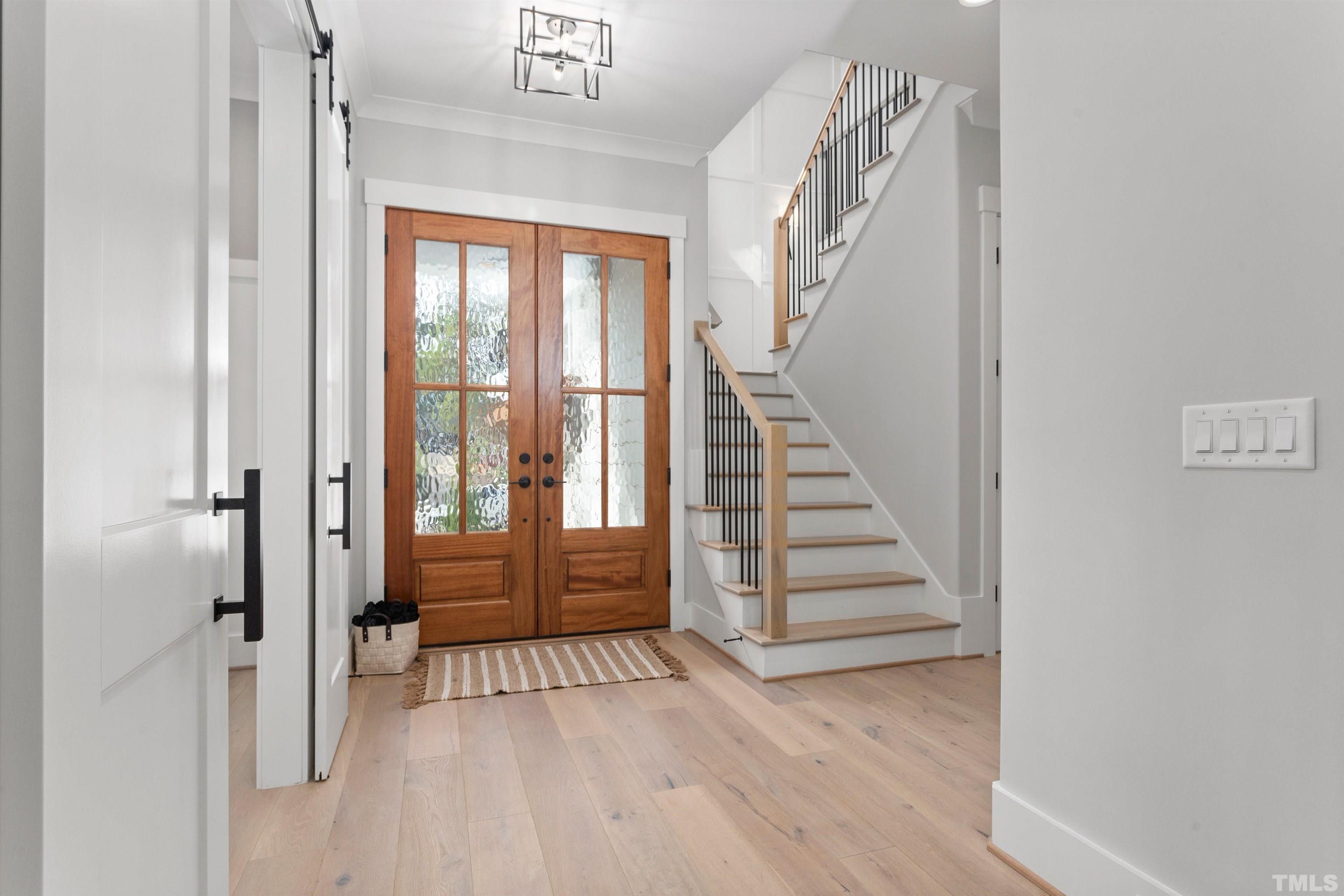 3508 Leonard Street Raleigh, NC 27607 - Photo 6 of 54 a view of a hallway with wooden floor and entryway