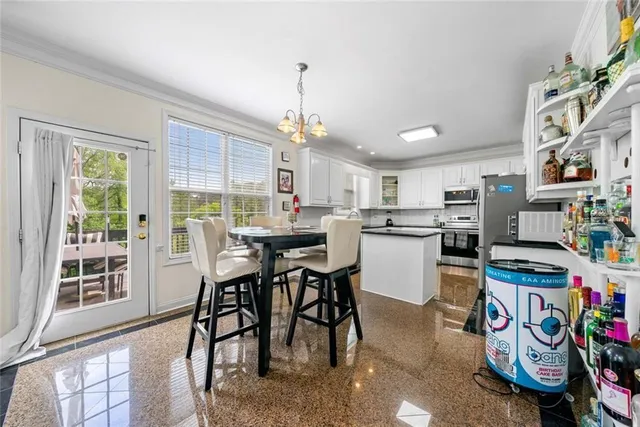 a en suite bathroom with a double vanity sink a mirror and shower