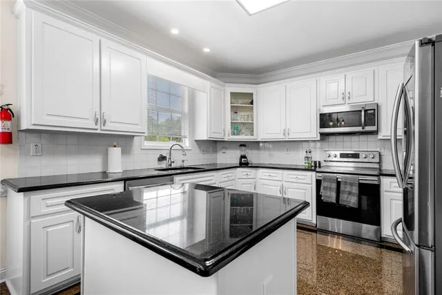 a bed room with a bed and a chandelier