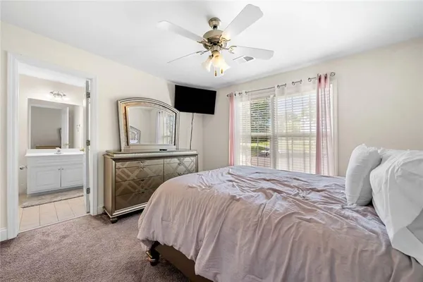 a bed room with a bed and a television