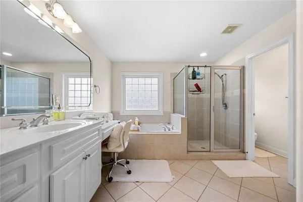 a view of a bathroom with dual sinks