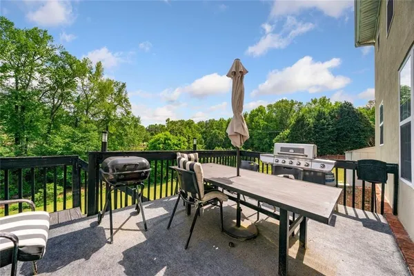a view of a chairs and table in patio