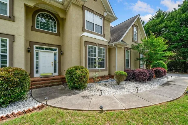 a view of entryway with wooden floor and windows