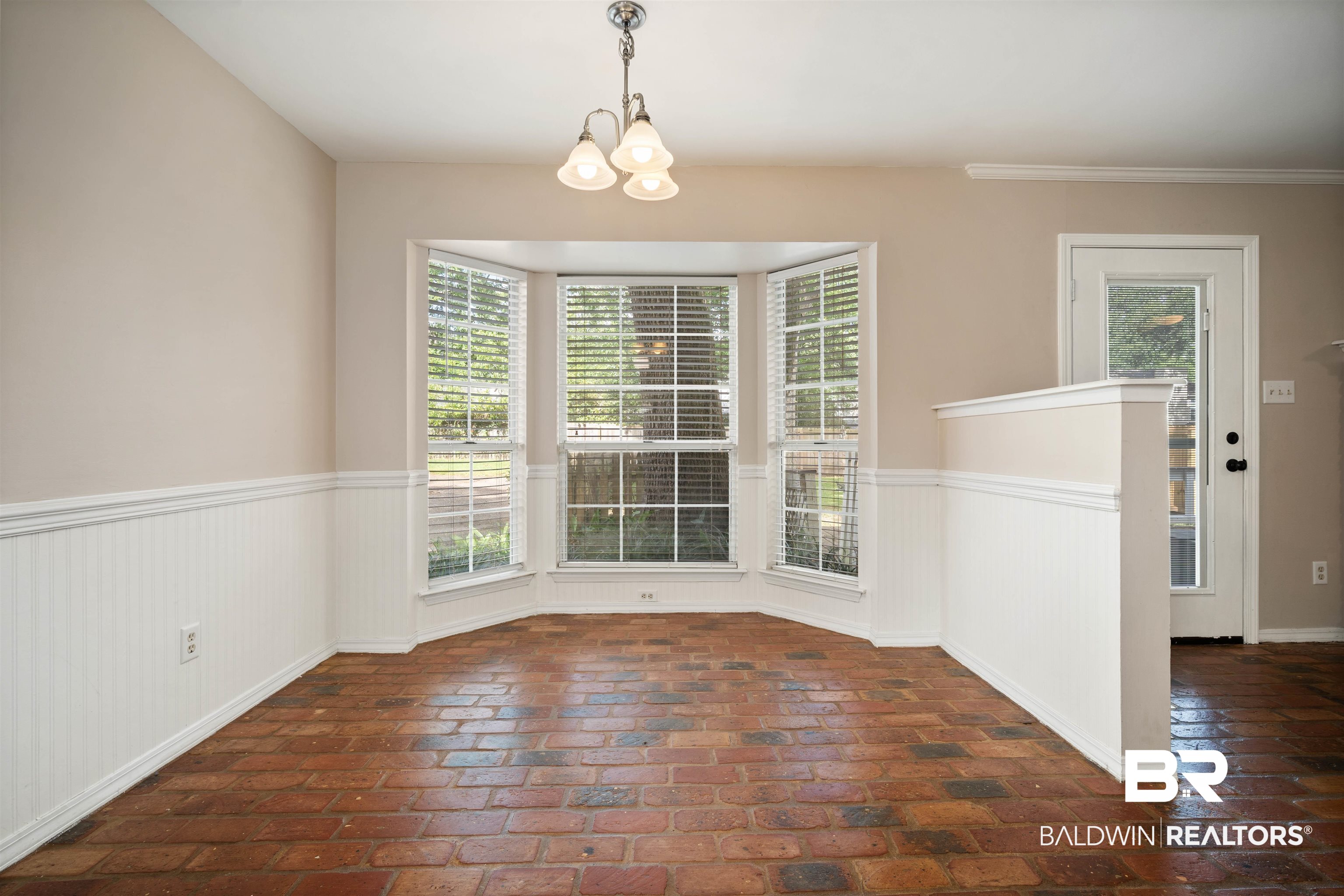 804 Wildwood Avenue Mobile, AL 36609 - Photo 11 of 30 Unfurnished dining area featuring a chandelier