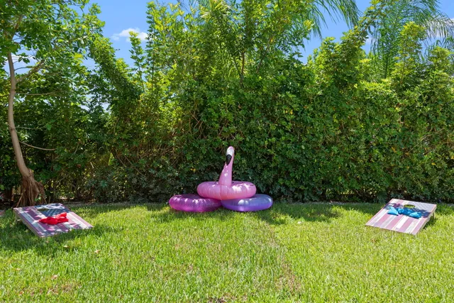 a backyard of a house with table and chairs