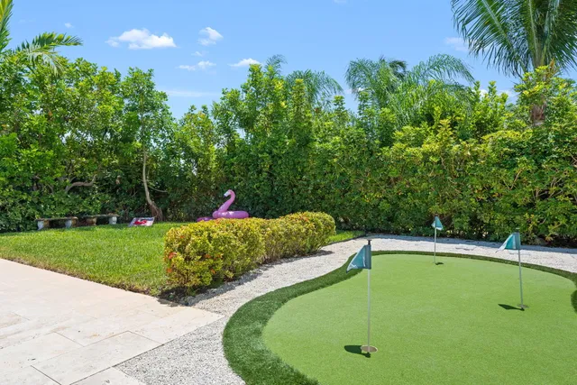 a view of a swimming pool with a yard