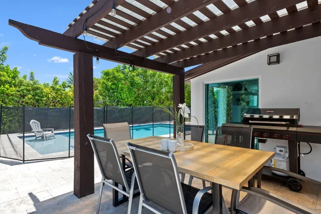 a outdoor dining space with furniture and outdoor view