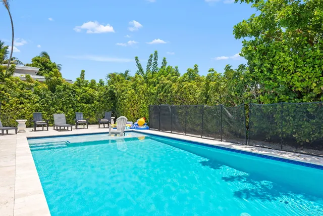 a swimming pool with wooden fence