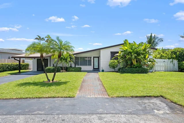 a house with a garden and a yard