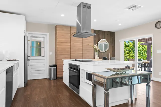 a kitchen with a stove and a window