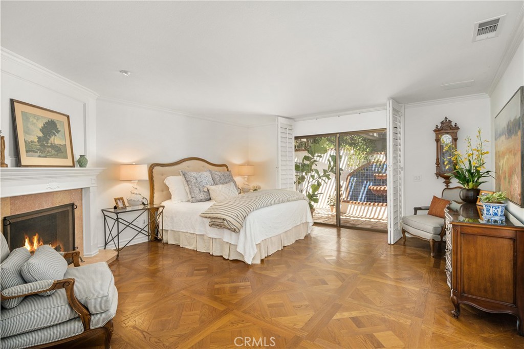 9741 Rangeview Drive North Tustin, CA 92705 - Photo 16 of 48 a spacious bedroom with a bed and a couch