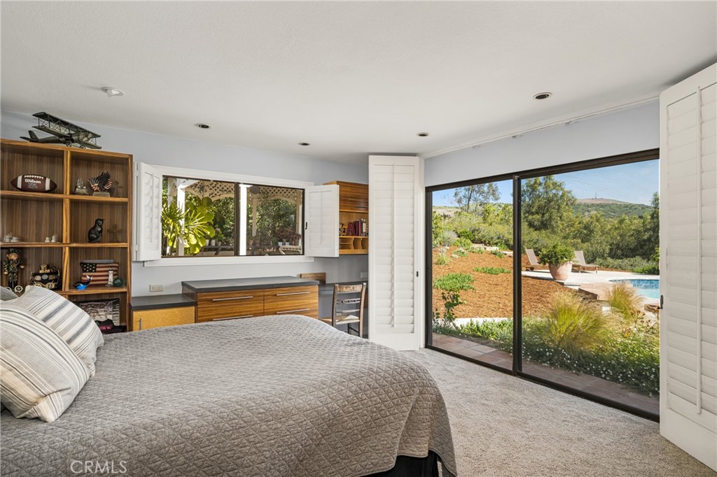 9741 Rangeview Drive North Tustin, CA 92705 - Photo 19 of 48 a bedroom with furniture and a large window