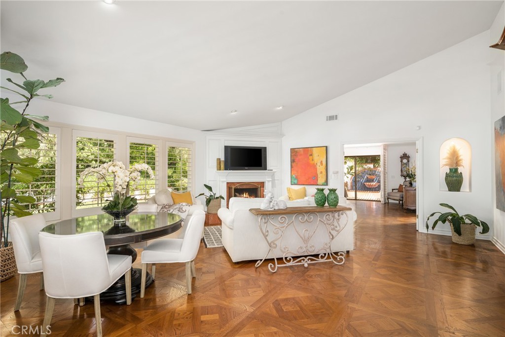 9741 Rangeview Drive North Tustin, CA 92705 - Photo 48 of 48 Light & bright, open floor plan! Vaulted ceilings, a wall of glass, marble-faced fireplace and parquet floors highlight the living room.