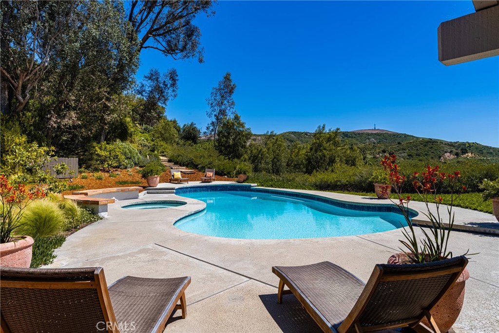9741 Rangeview Drive North Tustin, CA 92705 - Photo 23 of 48 a view of a swimming pool with lounge chairs