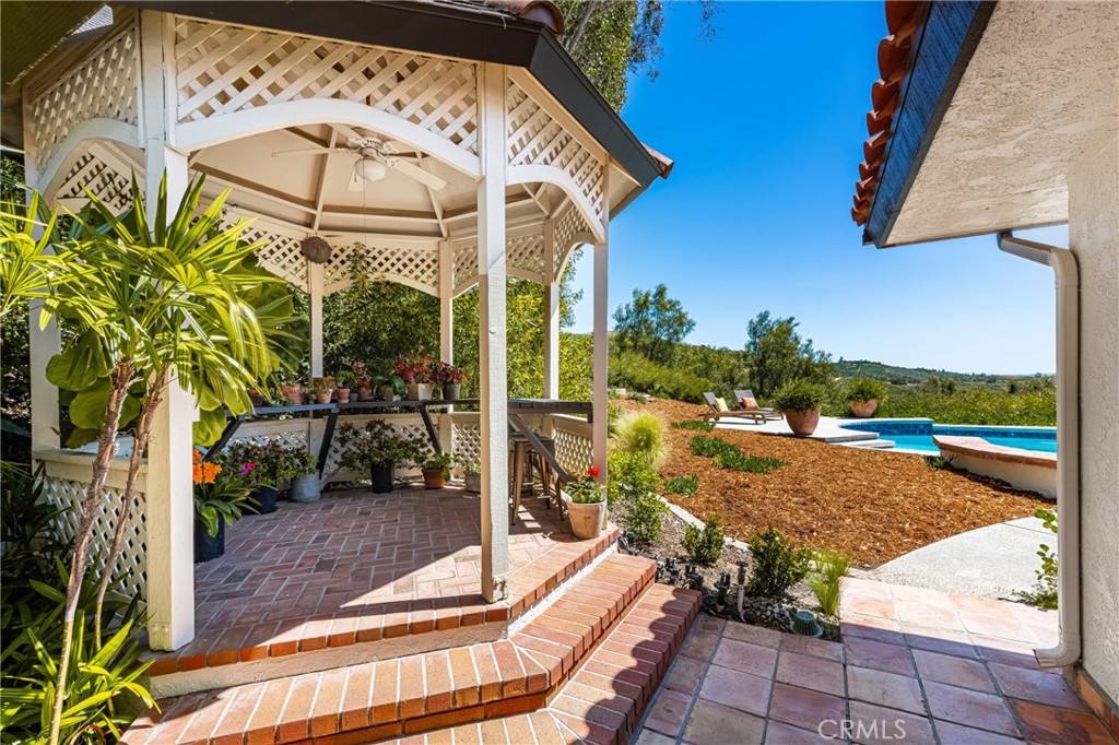 9741 Rangeview Drive North Tustin, CA 92705 - Photo 26 of 48 a view of a porch with a bench in patio