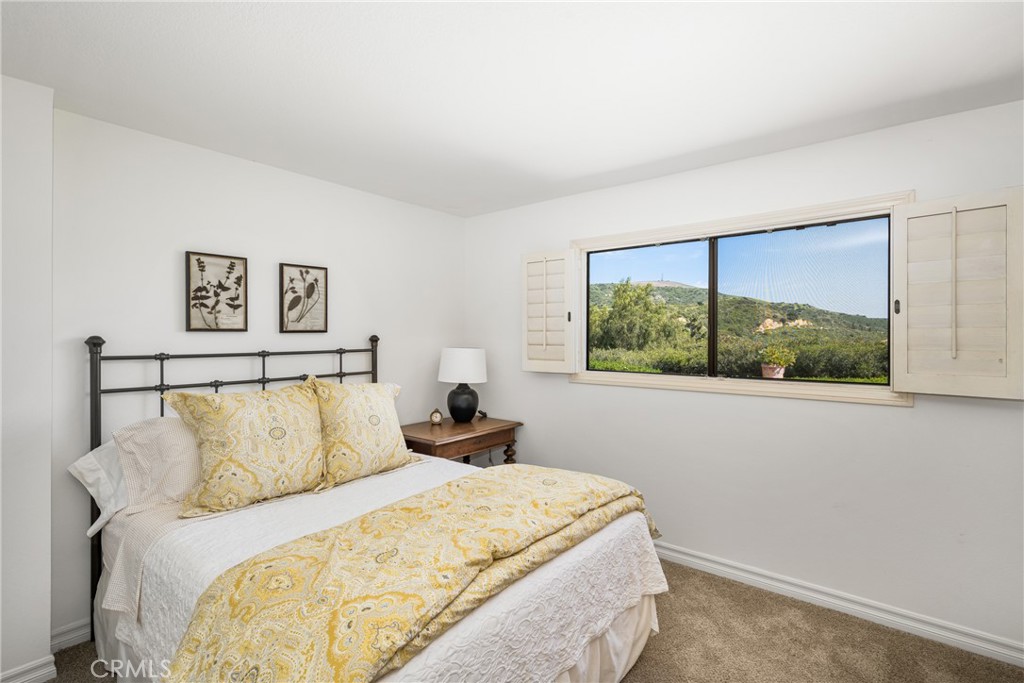 9741 Rangeview Drive North Tustin, CA 92705 - Photo 27 of 48 a bed sitting in a bedroom next to a window