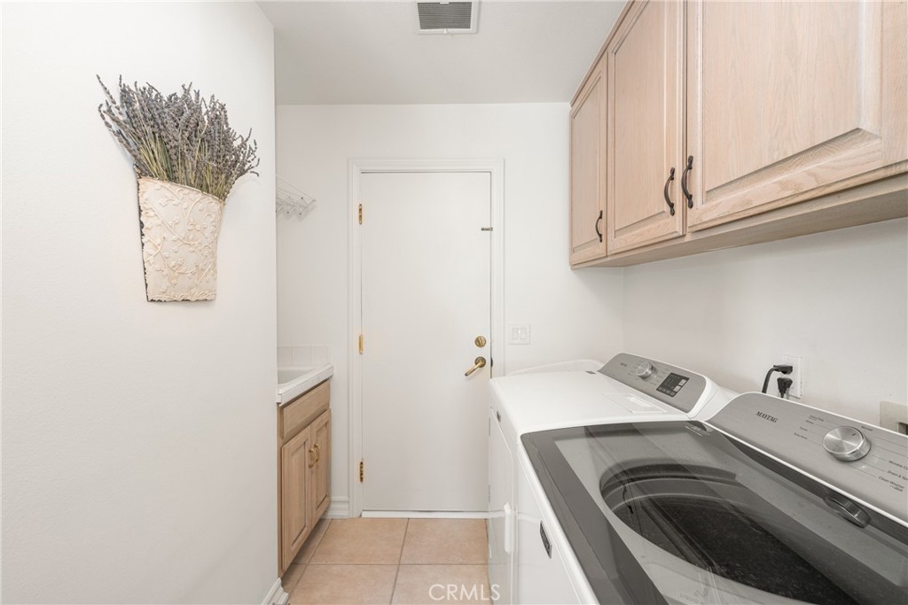 9741 Rangeview Drive North Tustin, CA 92705 - Photo 43 of 48 a utility room with dryer and washer