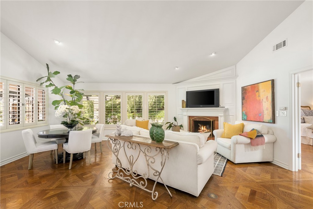 9741 Rangeview Drive North Tustin, CA 92705 - Photo 8 of 48 A marble fireplace warms the living room. Current owners use the space for formal living and dining but a grand piano fits beautifully here and there is a formal dining room and covered patio for entertaining a crowd as well.
