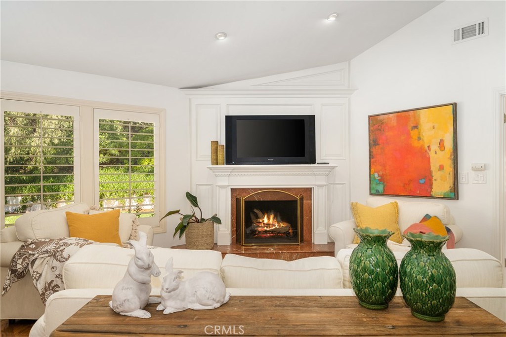 9741 Rangeview Drive North Tustin, CA 92705 - Photo 9 of 48 a living room with furniture fireplace and flat screen tv