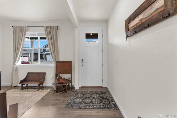 a bed room with furniture and a flat screen tv