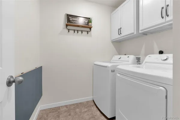 a view of a bedroom with furniture and closet area