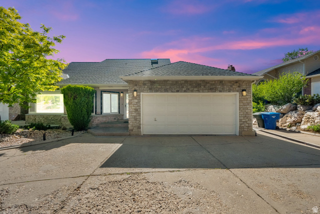 5057 South Ridgedale Drive Ogden, UT 84403 - Photo 2 of 69 Stone veneer facade with an attached two-car garage