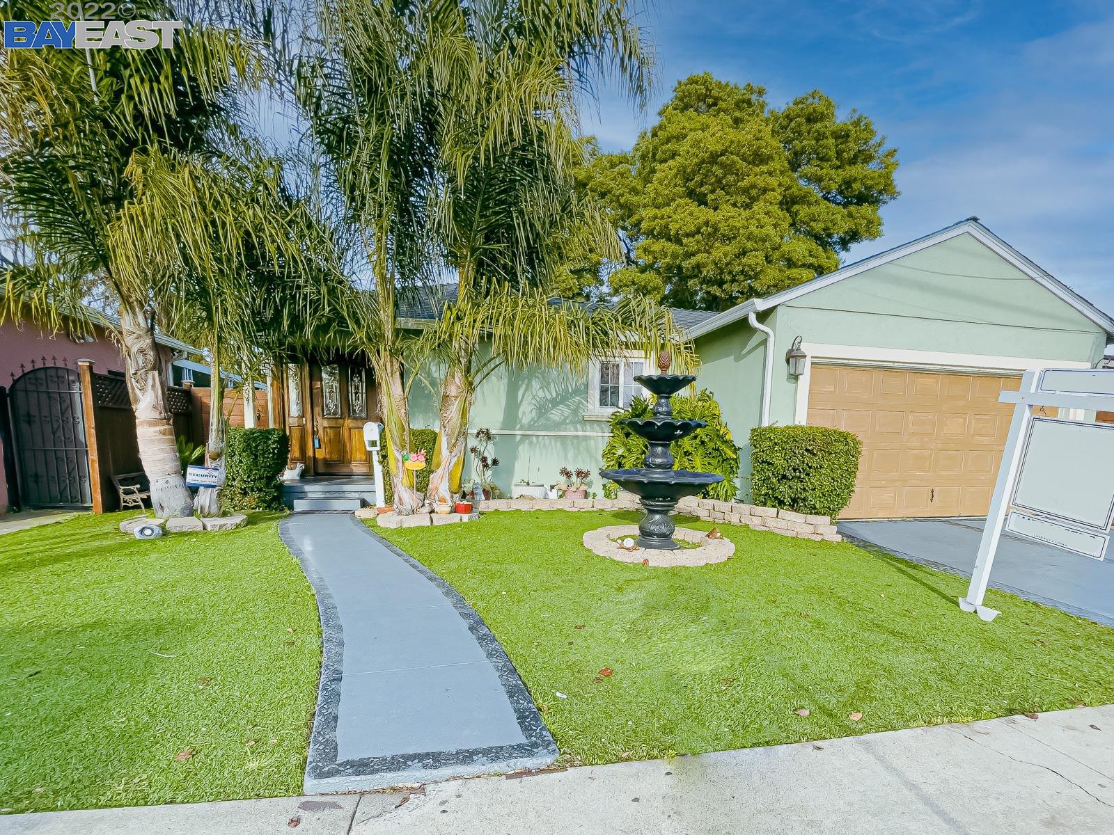 24664 Soto Road Hayward, CA 94544 - Photo 1 of 1 a view of a backyard with table and chairs potted plants and palm trees