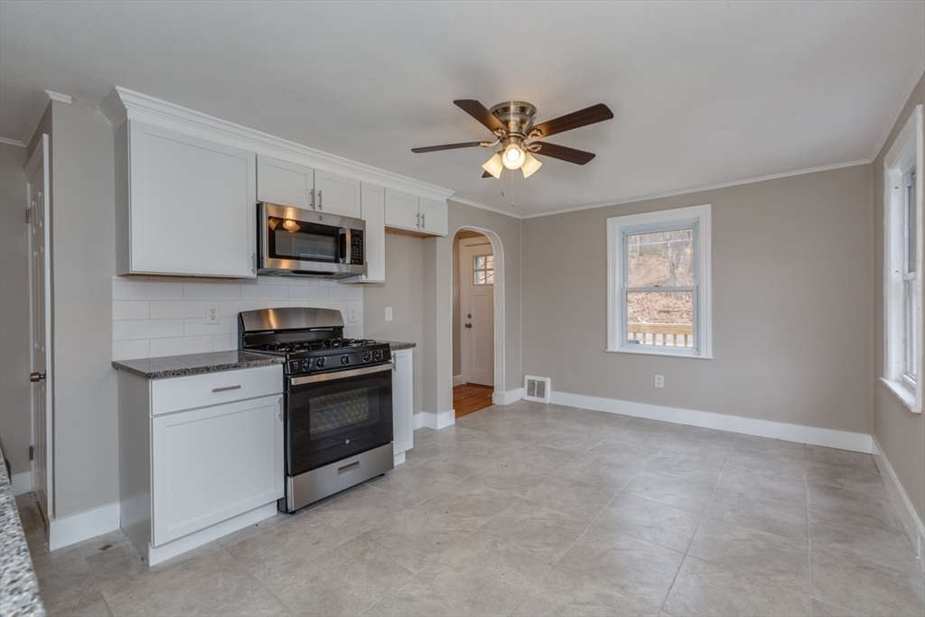 910 Fitchburg State Road Ashby, MA 01431 - Photo 8 of 18 a view of a kitchen with electric appliances and a window