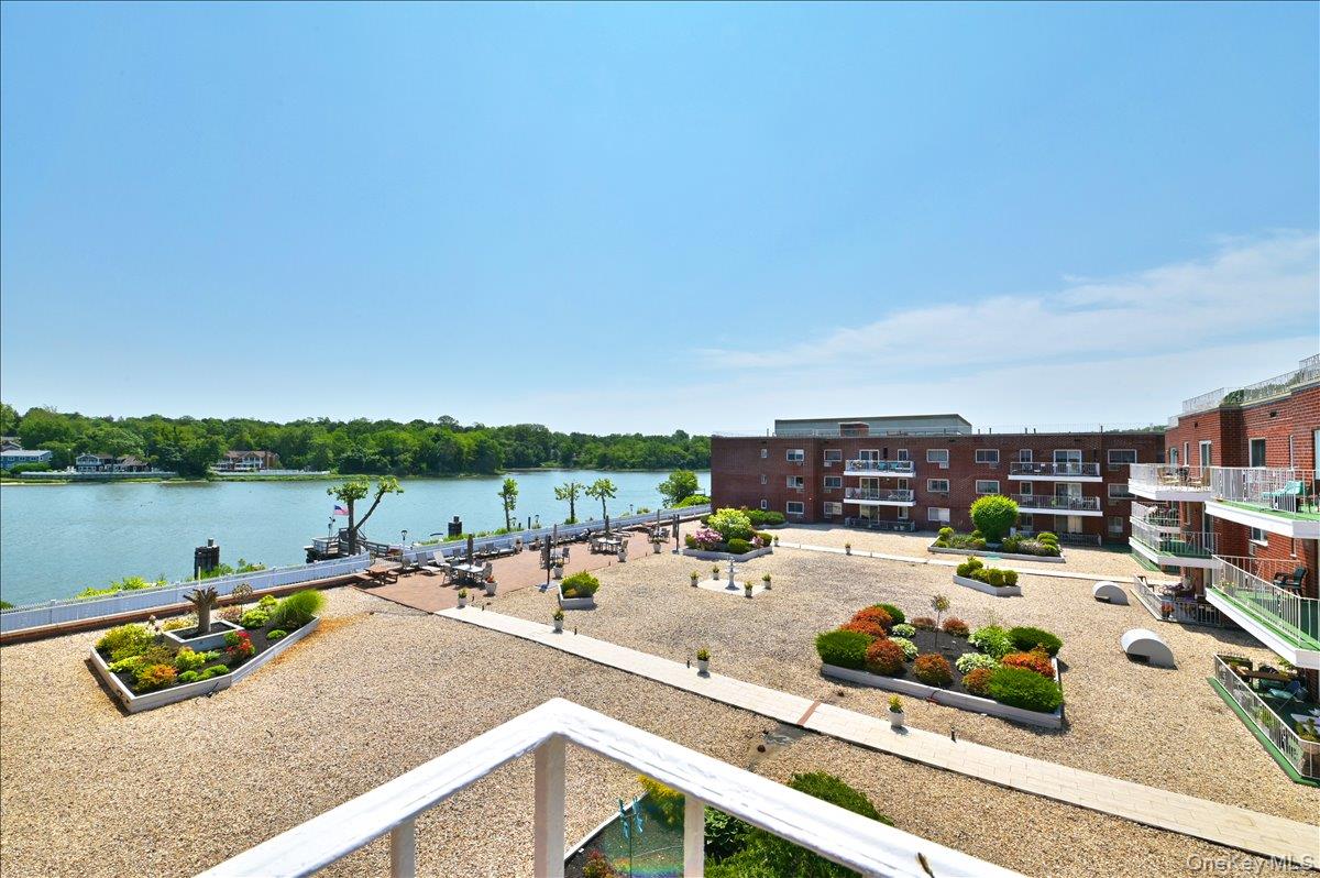 320 East Shore Road, Unit 4C Great Neck, NY 11023 - Photo 23 of 33 a view of a lake with houses