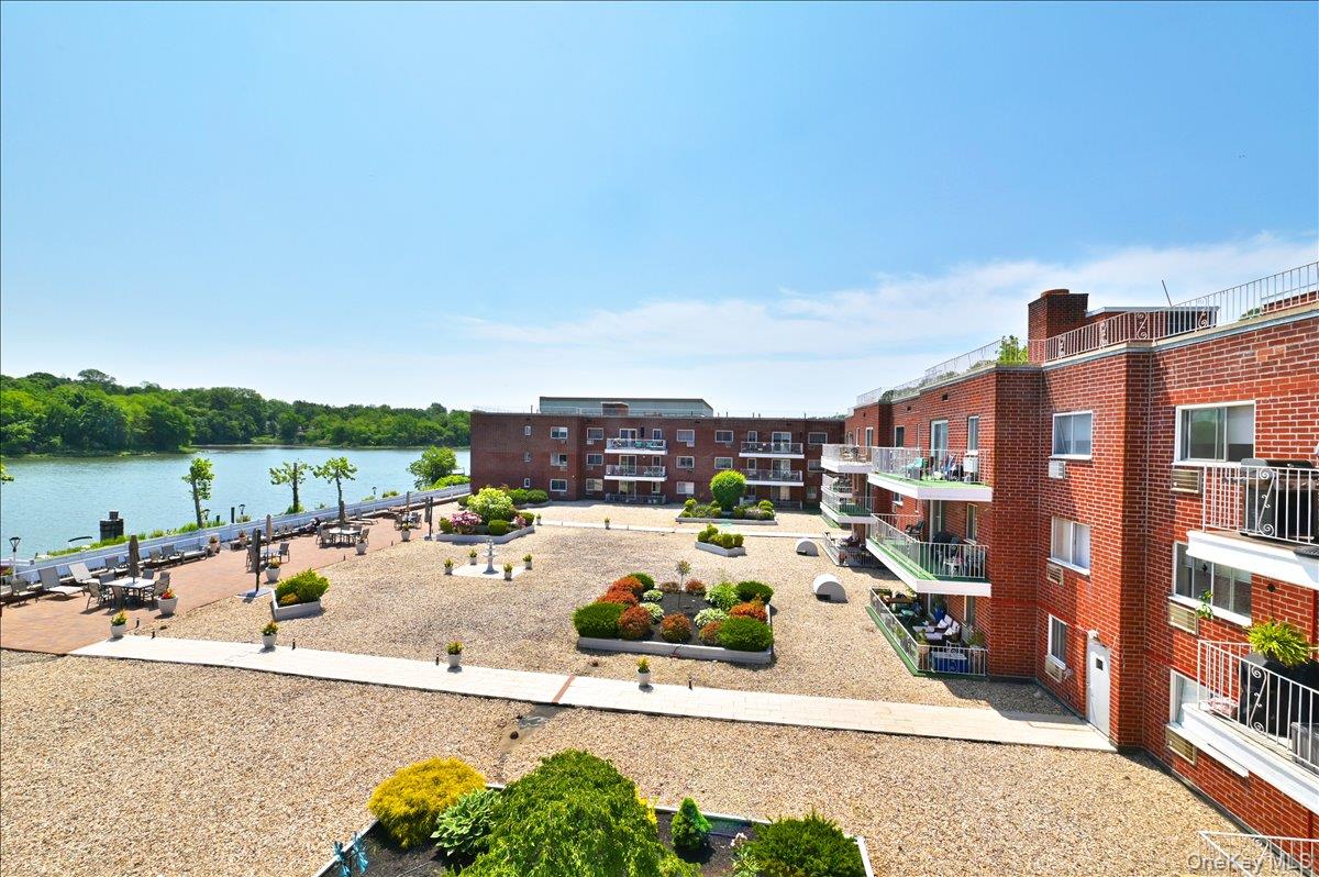 320 East Shore Road, Unit 4C Great Neck, NY 11023 - Photo 25 of 31 View of community featuring a water view