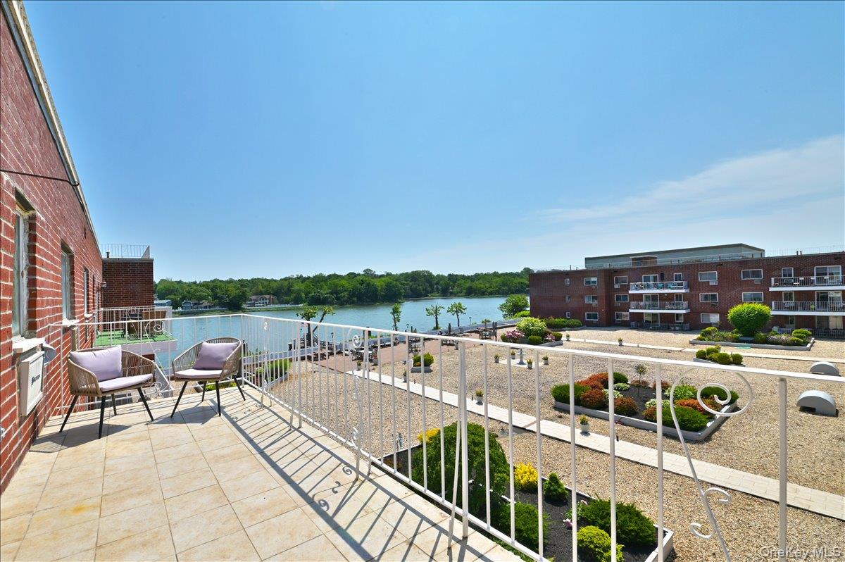 320 East Shore Road, Unit 4C Great Neck, NY 11023 - Photo 26 of 31 Balcony featuring a water view