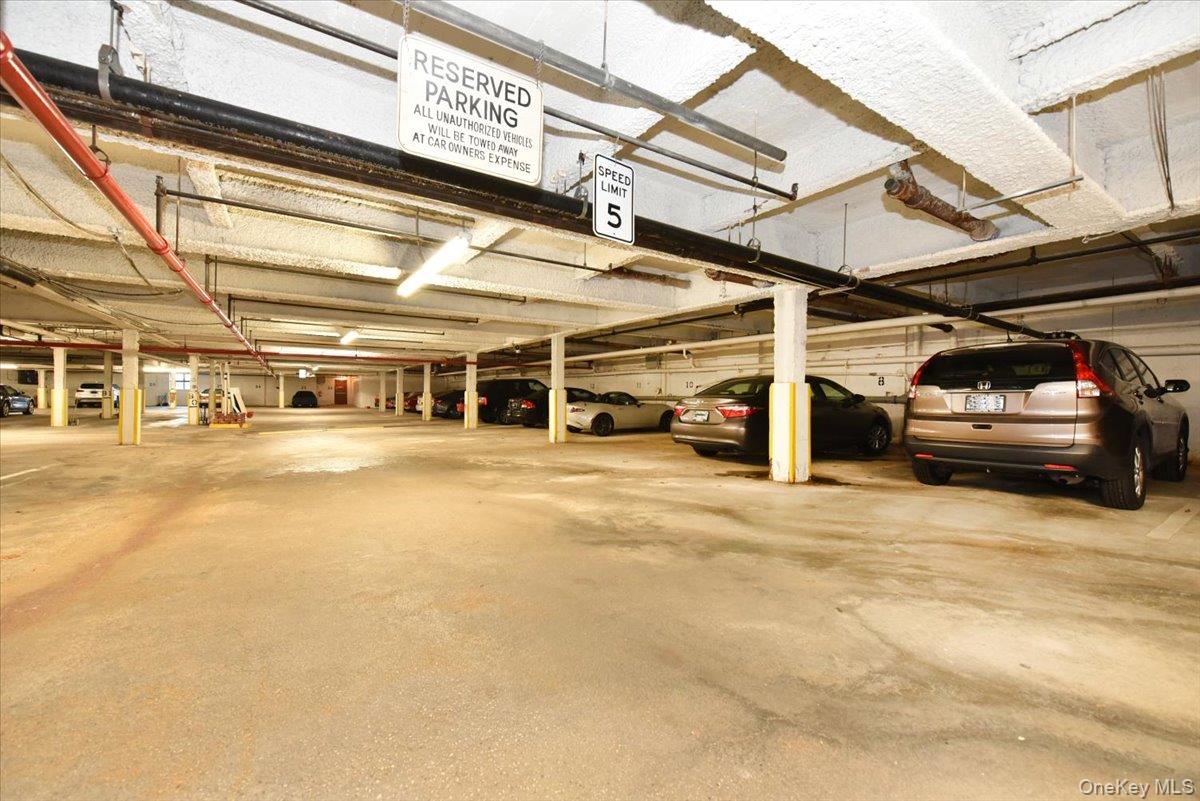 320 East Shore Road, Unit 4C Great Neck, NY 11023 - Photo 29 of 33 a view of parking garage with cars