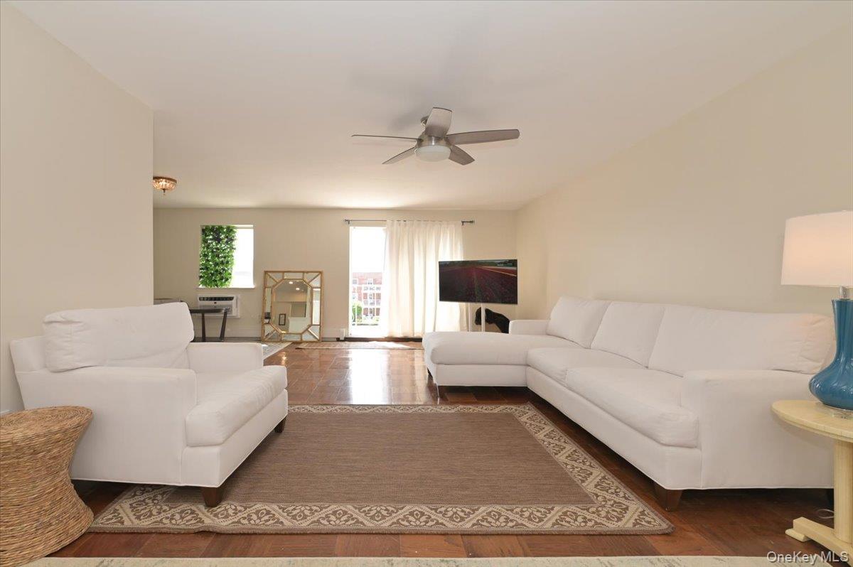 320 East Shore Road, Unit 4C Great Neck, NY 11023 - Photo 7 of 31 Living room with wood finished floors and ceiling fan