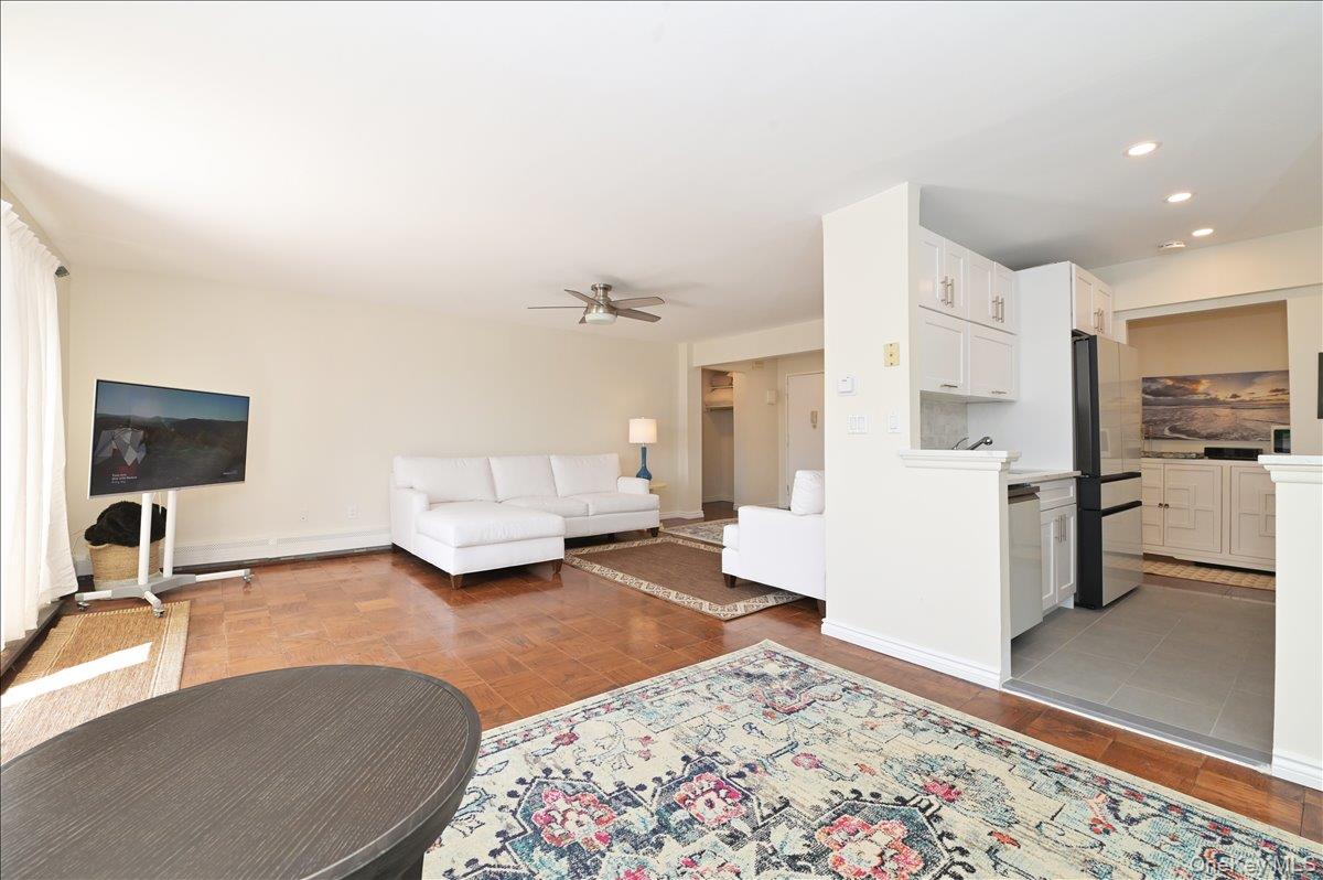 320 East Shore Road, Unit 4C Great Neck, NY 11023 - Photo 10 of 29 Living area with a ceiling fan, light wood-style floors, and recessed lighting