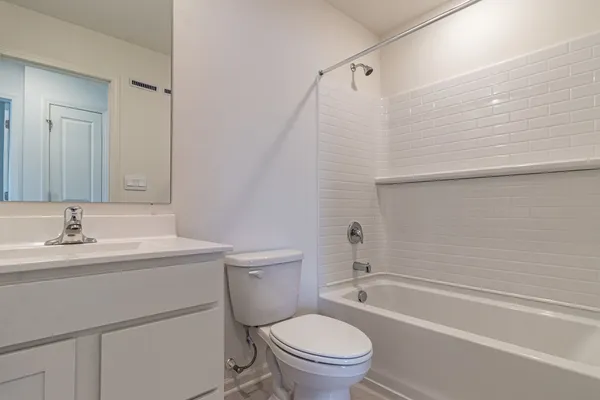 a bathroom with a toilet a sink and a bathtub