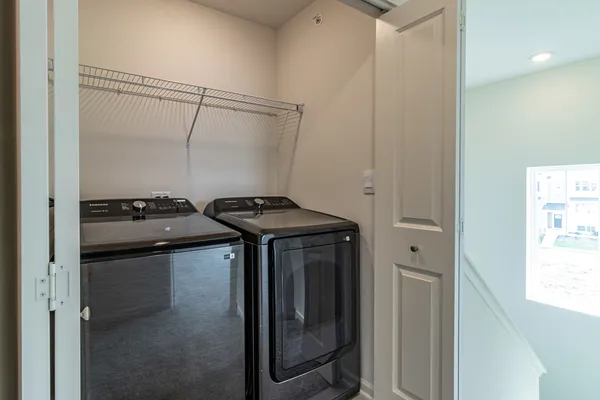 a utility room with dryer and washer