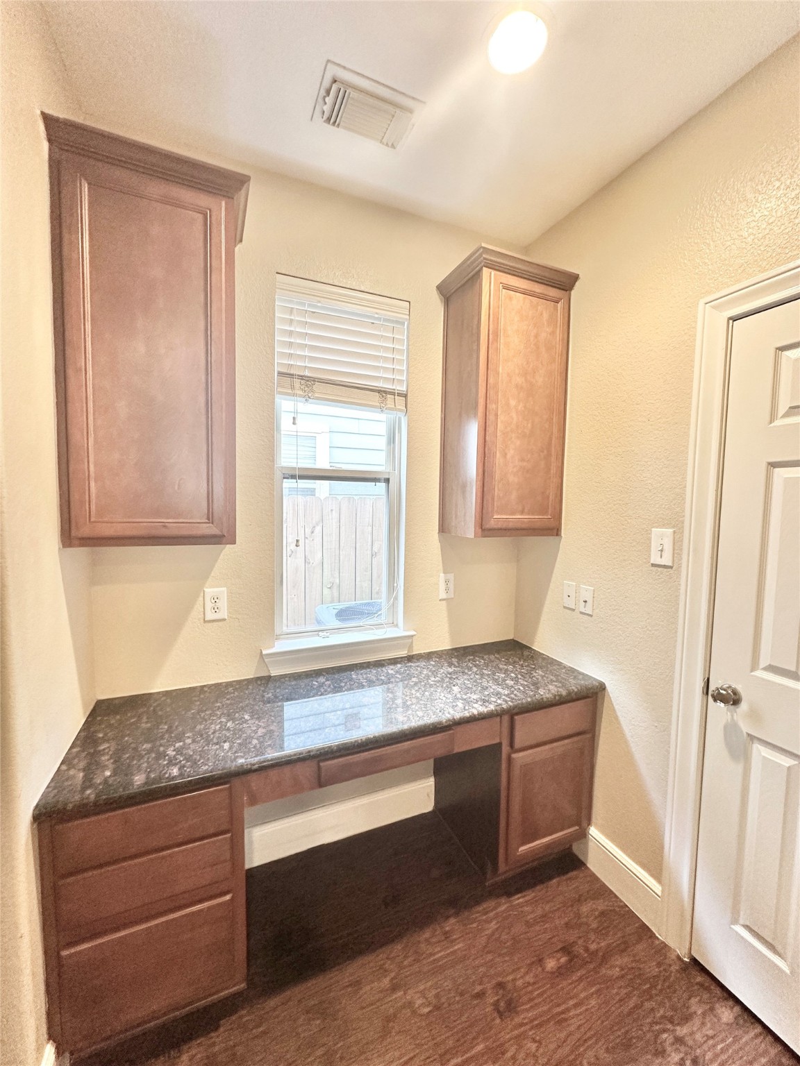 43 Panterra Way Spring, TX 77382 - Photo 9 of 17 a kitchen with granite countertop cabinets stainless steel appliances and a window