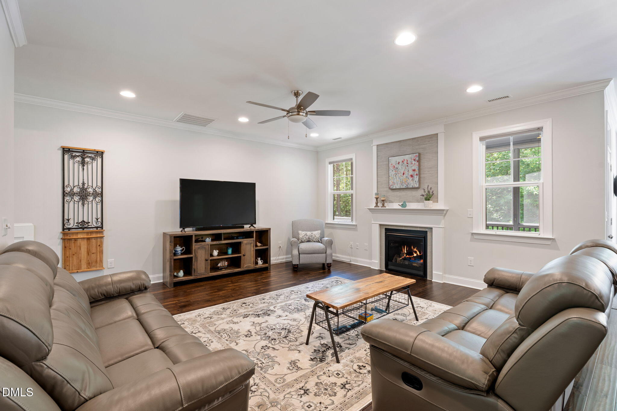 223 Colonial Ridge Drive Pittsboro, NC 27312 - Photo 12 of 47 a living room with furniture and a flat screen tv