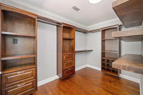 a room with wooden floor and furniture