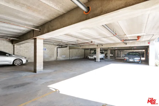 a view of parking garage with cars