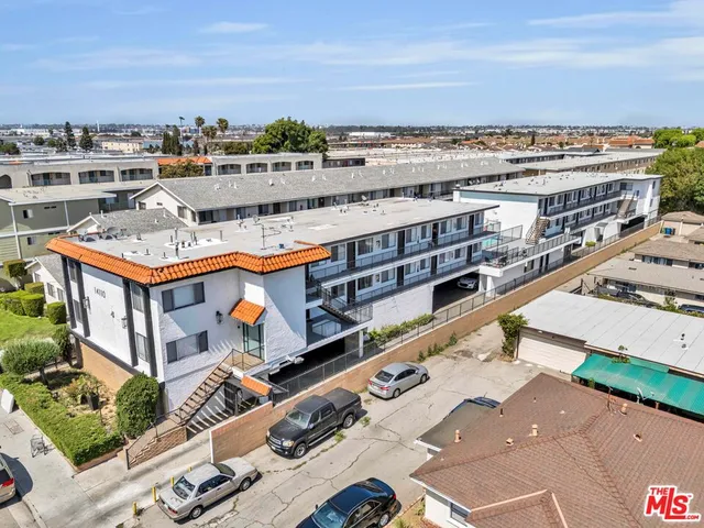 a living room with furniture kitchen and a window