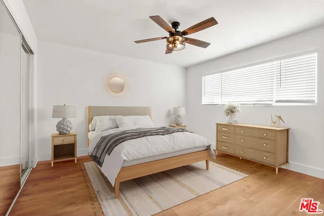 a bed room with a bed and a window