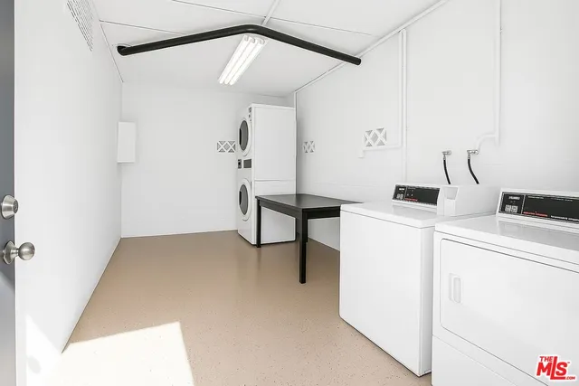 a view of storage and utility room with windows