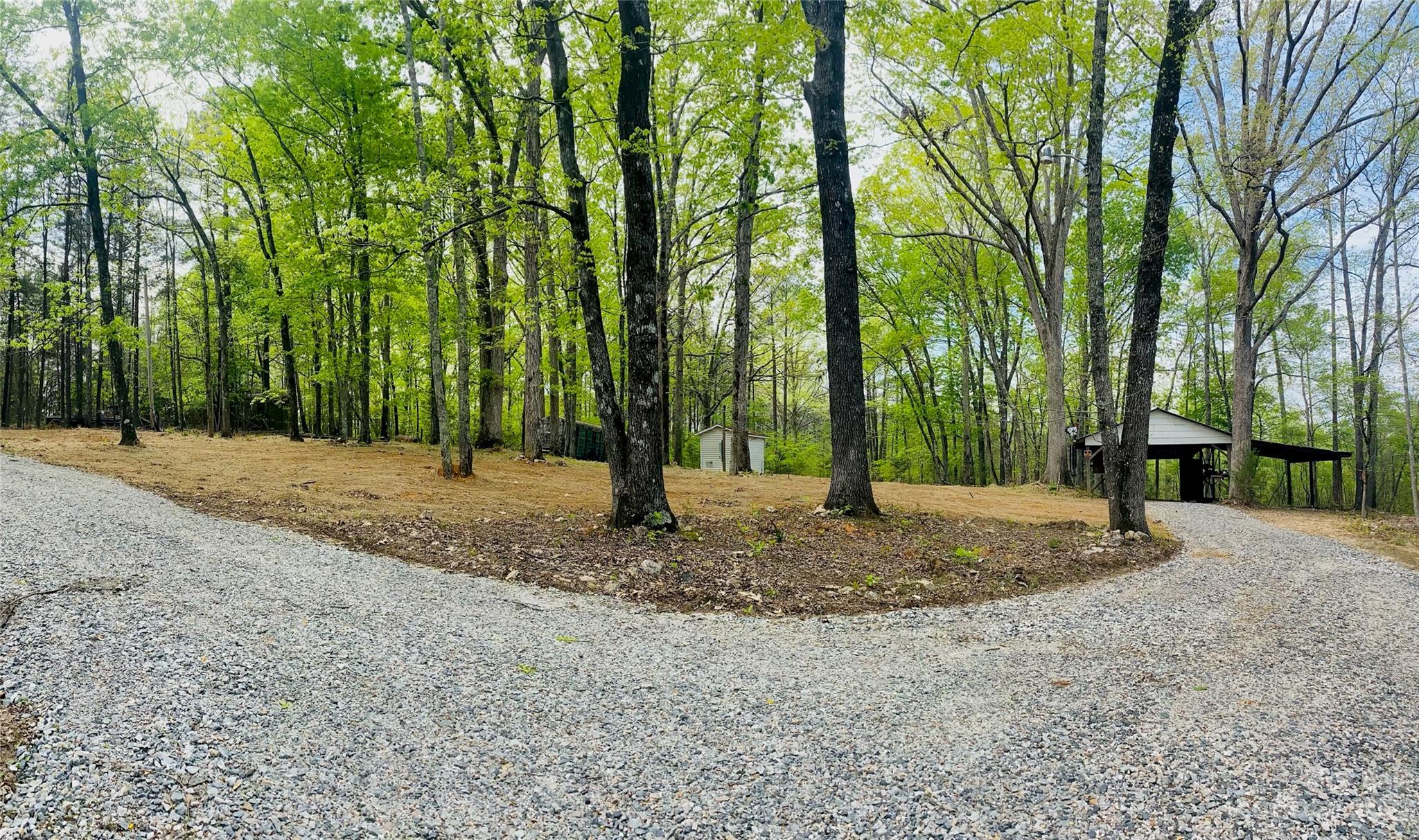 656 Fairforest Road Chester, SC 29706 - Photo 1 of 22 a view of a backyard with large trees