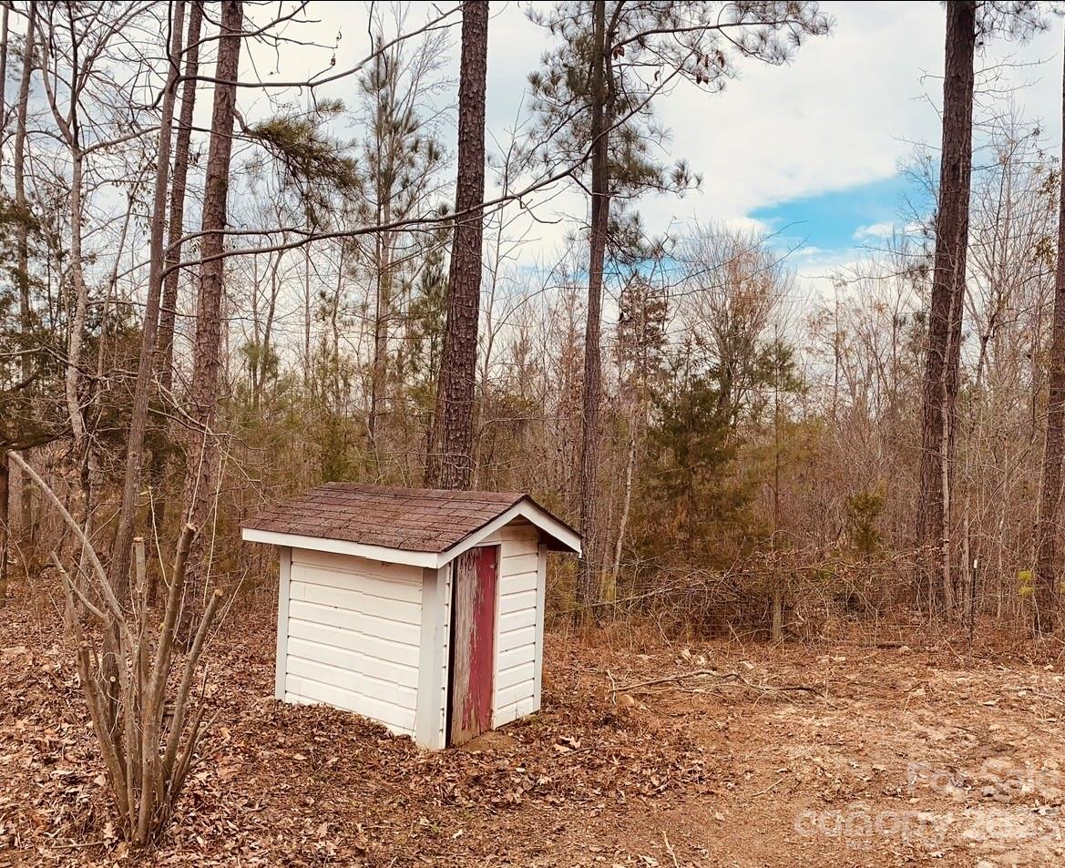 656 Fairforest Road Chester, SC 29706 - Photo 21 of 22 a view of a house with a yard and wooden fence