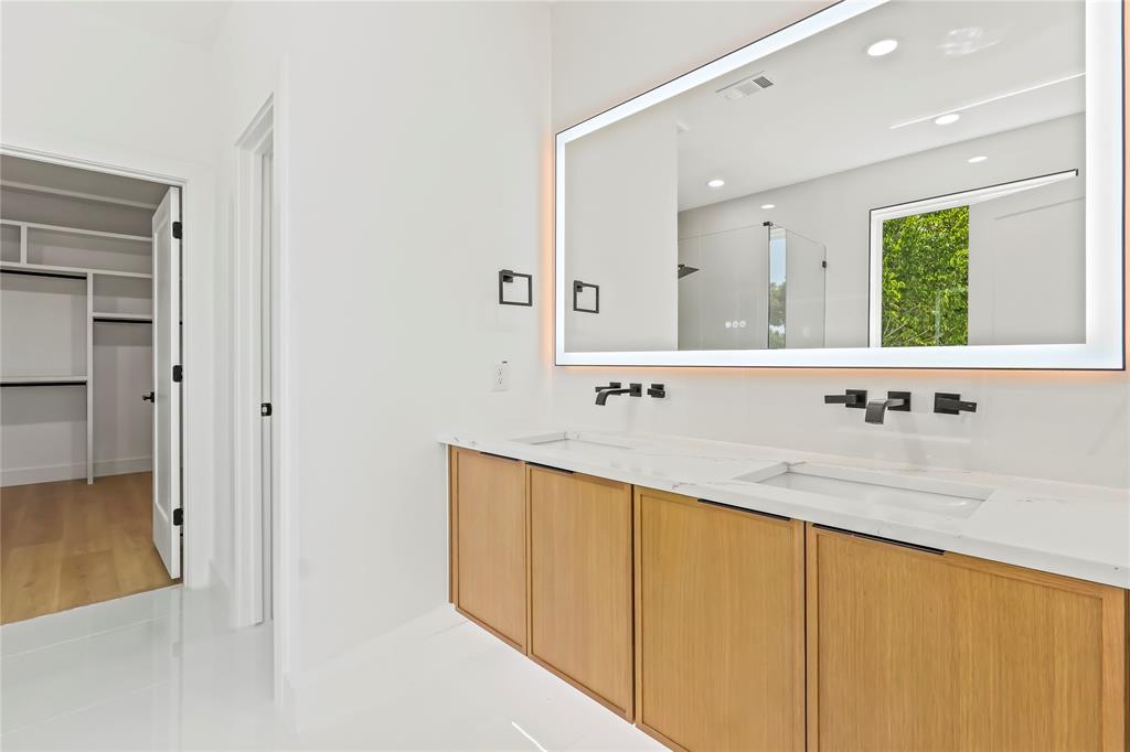 1312 Compton Street Dallas, TX 75203 - Photo 20 of 31 a bathroom with a sink and a mirror