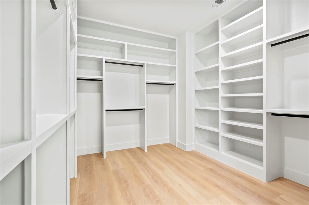 1312 Compton Street Dallas, TX 75203 - Photo 22 of 31 a view of walk in closet with empty racks