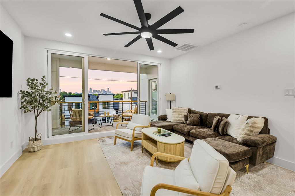 1312 Compton Street Dallas, TX 75203 - Photo 28 of 31 a living room with furniture and a large window