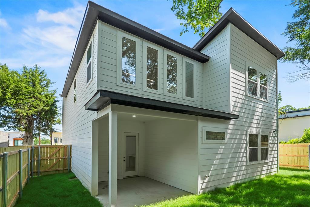 1312 Compton Street Dallas, TX 75203 - Photo 3 of 31 a view of a house with many windows